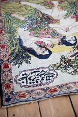 Antique Kerman rug's intricate border, Farsi inscription cartouche, and finished fringe.
