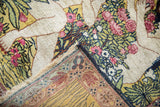 Intricate rose, green, ivory pictorial foliage and woven foundation detail of antique Kerman rug.
