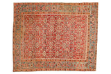 Antique Persian Heriz rug with an allover geometric Herati design in cherry red, dusty teal, and rose.
