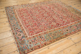 Angled view of a Persian Heriz rug's geometric border with Turtle and Samovar design elements.