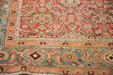 Close-up of the antique Heriz border showing geometric Turtle Samovar motifs and low, even pile.