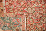 Detail of an antique Heriz corner showing the hand-knotted wool pile, foundation, and intact side cord.