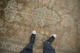 Distressed antique Mahal carpet with time-softened sand and powder blue floral palmettes.