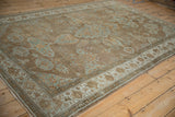 Distressed antique Mahal carpet field with powder blue palmettes and softened earthy tones.