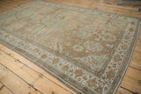 Antique Distressed Persian Mahal rug corner with worn pile and powder blue florals.