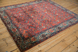 Vintage Malayer rug corner detail with fringe, side selvage, and pale blue border.