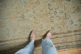 Distressed Malayer carpet's faded Herati pattern, beige and powder blue tones, and border detail.