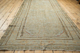 Distressed Malayer carpet displaying mostly even wear, faint foundation, and Samovar Turtle border.