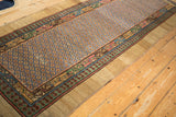 Antique Serab runner showing the wide camel border framing the geometric pawn and lattice design motifs.