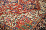 Detailed view of the hand-knotted pile in the Turtle Samovar border of a vintage Heriz carpet.