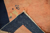 Dense navy blue hand-knotted foundation on the reverse of an antique Chinese Peking rug corner.