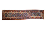 Antique Northwest Persian rug runner with geometric guls on an abrashed navy field and rich burgundy red border.
