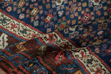 Plush, hand-knotted pile of an antique Northwest Persian runner showing rich color and even wear.