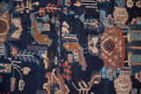 Vintage Afshar rug detail: cobalt blue field, stylized birds, madder red flowers, and soft pile wear.