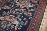 Hand-knotted vintage Afshar rug: intricate geometric birds, florals, and starburst border in navy, red, blue.