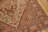 Mostly even wear on the pile of an antique Farahan Sarouk rug's corner spandrel and borders.