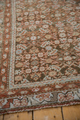 Close-up of distressed Northwest Persian runner with Herati pattern, terracotta, and soft blue hues.