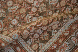 Textural detail of the vintage distressed Northwest Persian rug's worn Herati pile in soft terracotta, coffee, and blue.