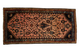 Vintage Mehreban rug runner with an elaborate vine and floral palmette design on a dusty magenta field with navy accents.