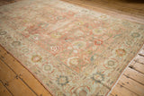 Angled corner detail of a distressed Mahal carpet showing its soft polished wool and intricate border.