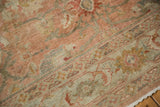 Evenly worn wool pile of a distressed Mahal carpet, with knot heads visible in dusty rose and silver hues.