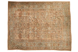 Vintage distressed Ghiordes carpet with an allover botanical field in sandalwood, copper, and slate blue.