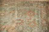 Detailed view of a Ghiordes carpet's border, showing mostly even wear to its knot heads.