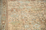 Angled view of the vintage Turkish carpet's low pile showing mostly even wear to the knot heads.