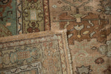 Folded corner of a vintage Ghiordes rug showing its woven back and intact side cord selvage.