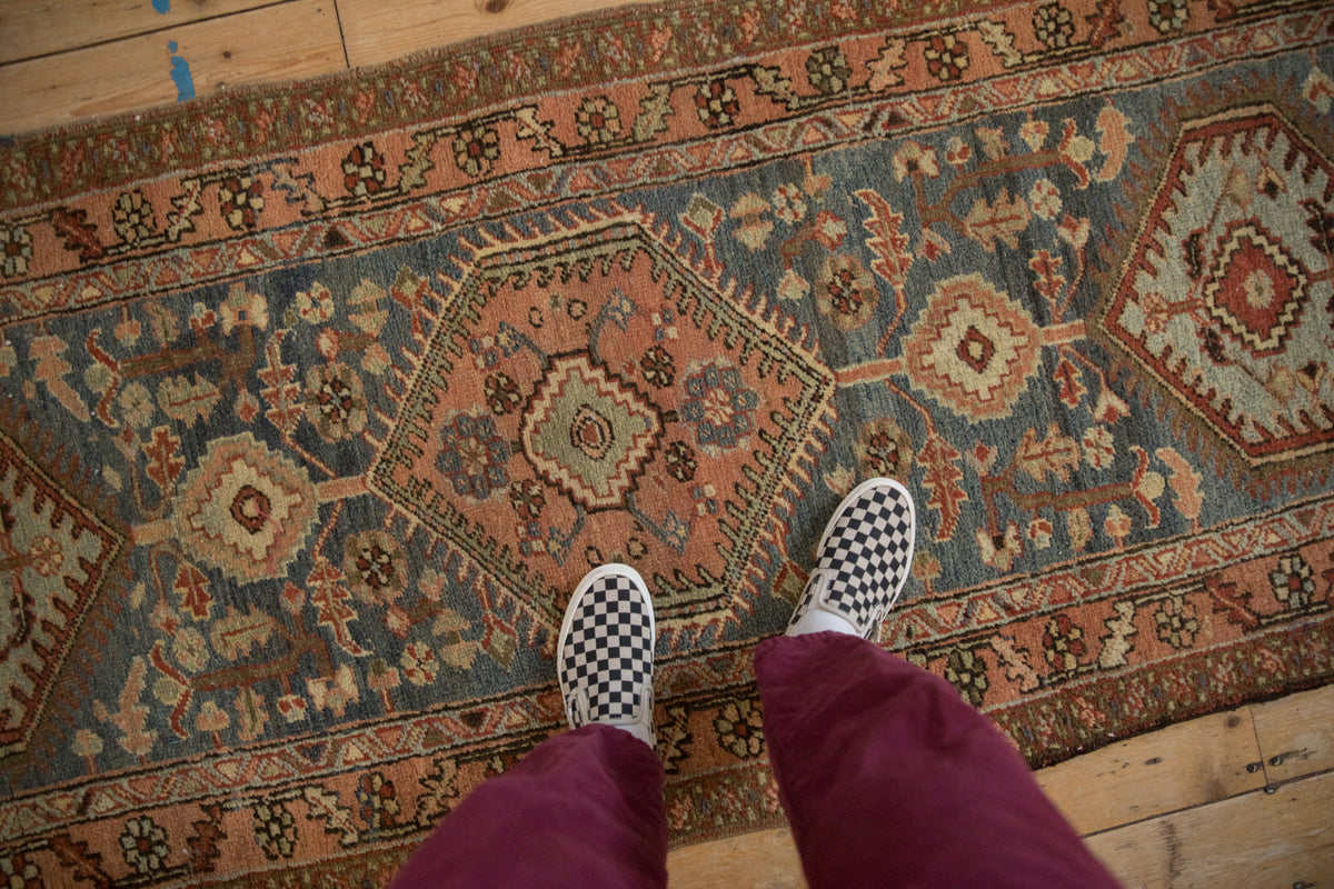 Vintage Heriz runner with geometric medallions, germinating blossoms, dusty rose, and slate blue.