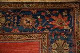 Antique Sultanabad carpet corner, sapphire blue border with colorful palmettes, ruby red field.