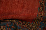 Striated cochineal red field and gem sapphire blue palmette border of antique Sultanabad carpet.