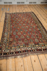 Qashqai rug right border, meandering vine detail, germinating shrub field in chestnut, blues, ivory.