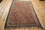 Antique Qashqai rug corner, showcasing geometric borders and areas of foundation wear.
