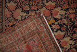 Antique Malayer rug showing dusty blush floral field and intricate germinating blossom border.