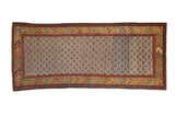 Antique Caucasian runner with a geometric blossom lattice field and a colorful, intricate main border.