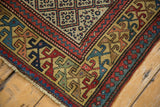 Intricate floral arabesque border and lattice panel design on an antique Caucasian runner rug.