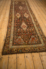 Kurdish Hamadan runner detail: intricate small flowers, diamond medallions, and floral main border.