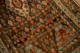 Antique Kurdish Hamadan rug detail: intricate small flowers, diamond medallions, and inner vine border, madder red, chocolate.