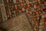 Antique Kurdish Hamadan rug showing intricate floral pile and its detailed hand-knotted foundation.