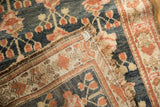 Folded antique Kurdish Hamadan runner, highlighting its muted floral field, border details, and side selvage.