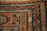 Intricate Caucasian zig-zag and reciprocating wave borders on an antique Soumac carpet.