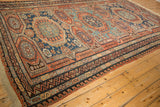 Original macrame fringe and complex borders on an antique Soumac carpet with zig-zag and wave motifs.