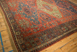 Intricate geometric borders and starburst florals on a circa 1910s Soumac design carpet.
