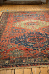 Angled perspective showing the natural color variations across the carpet's geometric motifs.