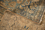 Hand-knotted foundation and wool pile visible on the folded corner of an antique Kerman carpet.