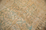 Mostly even wear to the knot heads and low pile texture of a distressed antique Kerman carpet.
