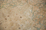 Detail of the antique Kerman rug's mostly even wear worn down to the knot heads.
