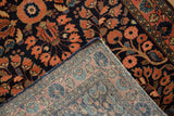 Hand knotted Sarouk runner's folded corner displays navy floral pile and intricate back foundation.