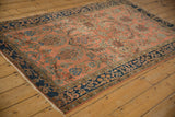 Antique Mohajeran Sarouk corner with indigo floral arabesque border and dusty blush field.